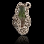 Hand crafted silver pendant with a green gem