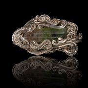 Hand crafted silver pendant with a green gem