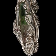 Hand crafted silver pendant with a green gem